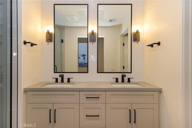 bathroom featuring an enclosed shower and vanity