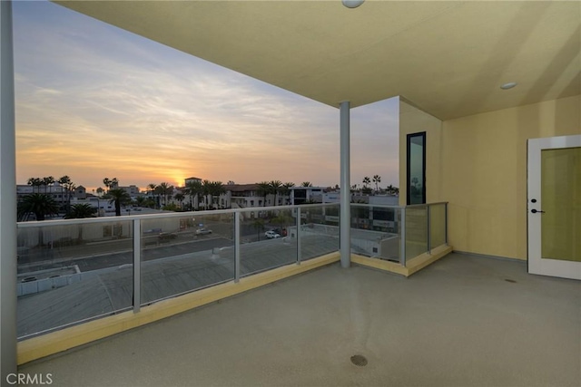 view of balcony at dusk