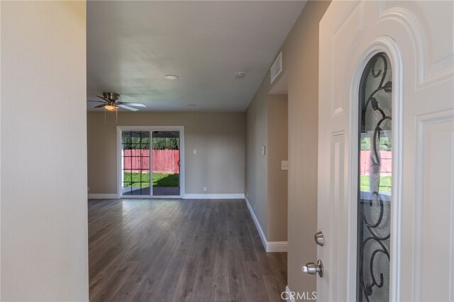 foyer featuring ceiling fan and dark hardwood / wood-style floors