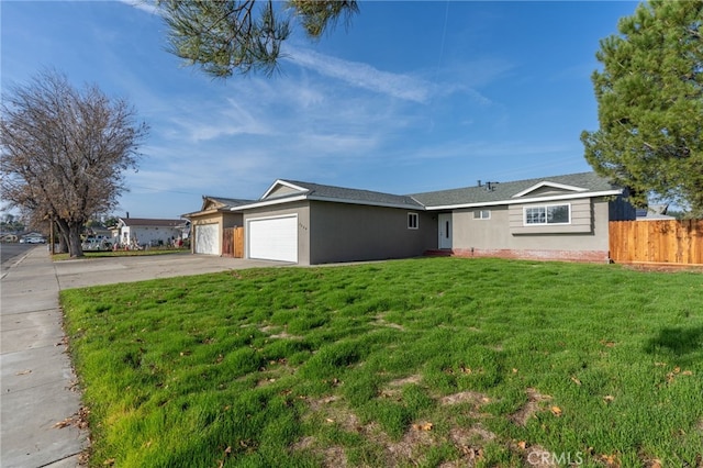 single story home featuring a front lawn and a garage