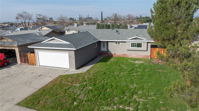 ranch-style house with a garage and a front lawn