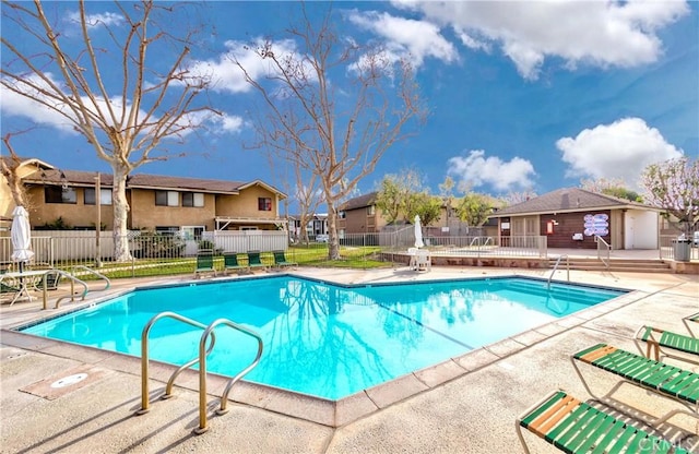 view of swimming pool featuring a patio area