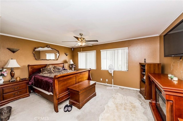 bedroom with ceiling fan, light carpet, and crown molding