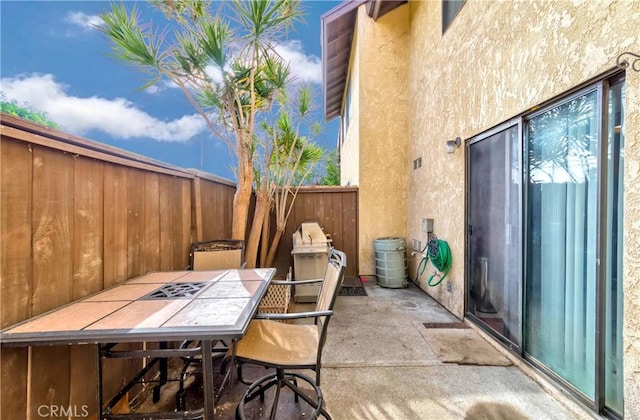 view of patio / terrace with outdoor dining space and a fenced backyard