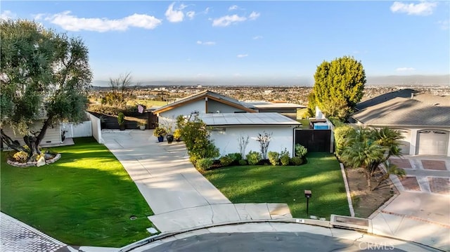 view of front of house featuring a garage and a front yard