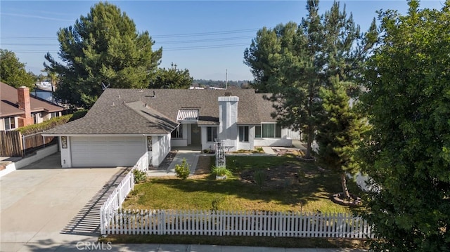 view of front of home with a front lawn and a garage