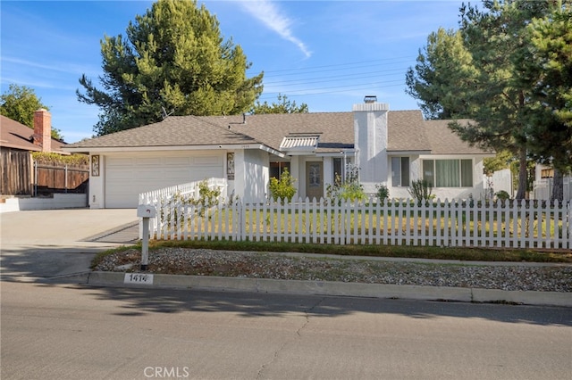 ranch-style home featuring a garage