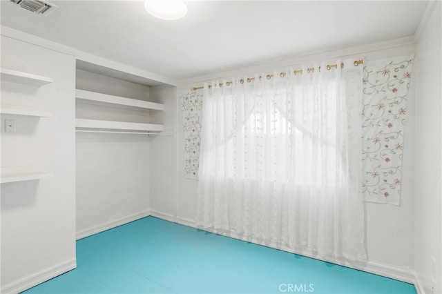 unfurnished room featuring ornamental molding