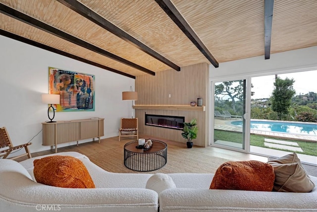 living room with a large fireplace, wood ceiling, light hardwood / wood-style flooring, and vaulted ceiling with beams