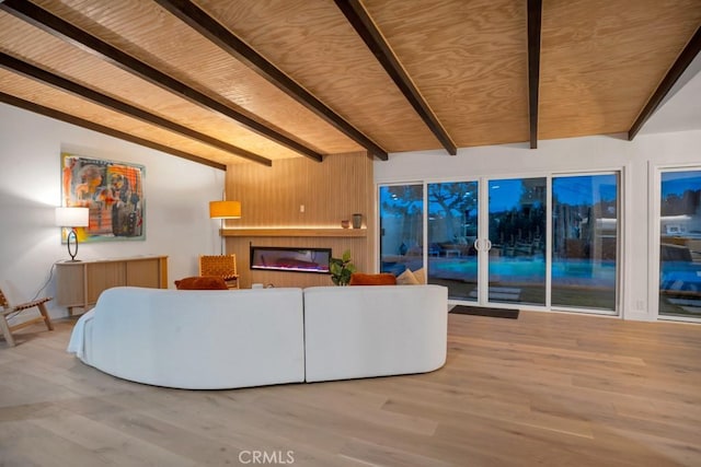 living room featuring vaulted ceiling with beams, light wood-type flooring, and wood ceiling