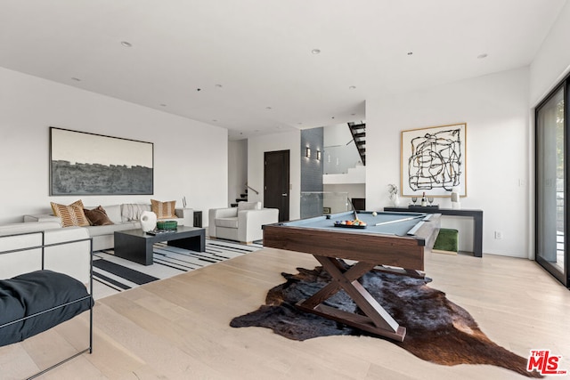 recreation room with light hardwood / wood-style floors and pool table