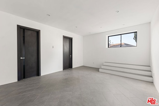 unfurnished room featuring tile patterned flooring