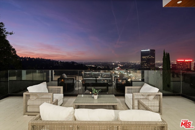 view of patio terrace at dusk