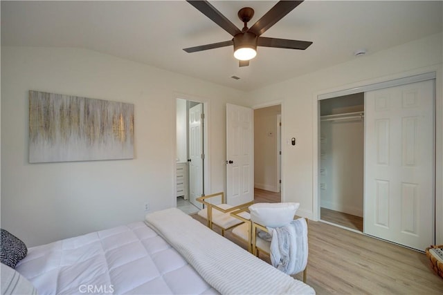 bedroom with ceiling fan, ensuite bathroom, a closet, and light wood-type flooring