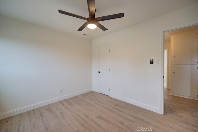 unfurnished room featuring light hardwood / wood-style floors and ceiling fan