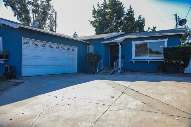 single story home featuring a garage