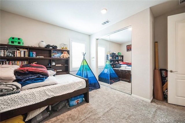 carpeted bedroom featuring a closet