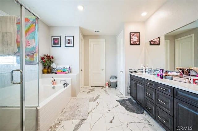 bathroom featuring independent shower and bath and vanity