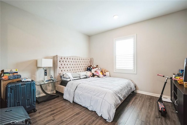 bedroom featuring dark hardwood / wood-style flooring