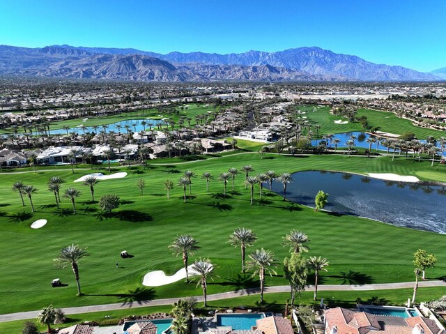 aerial view featuring a water and mountain view