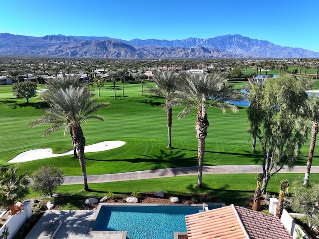 exterior space with a mountain view and a lawn