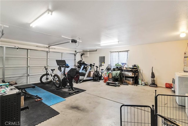 garage featuring electric panel and a garage door opener