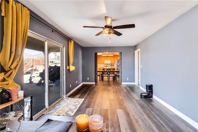 interior space featuring hardwood / wood-style flooring and ceiling fan