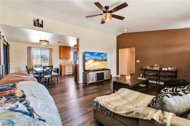 living room featuring ceiling fan, vaulted ceiling, and dark hardwood / wood-style flooring