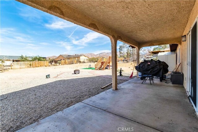 view of patio / terrace with a mountain view