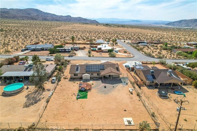 birds eye view of property featuring a mountain view