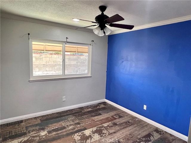 unfurnished room with ceiling fan, a textured ceiling, dark hardwood / wood-style floors, and ornamental molding