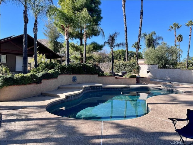 view of swimming pool with a patio area