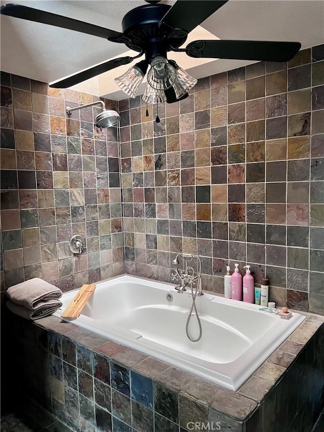 bathroom featuring tiled bath and ceiling fan