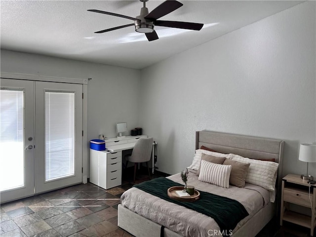 bedroom with ceiling fan, access to outside, and french doors