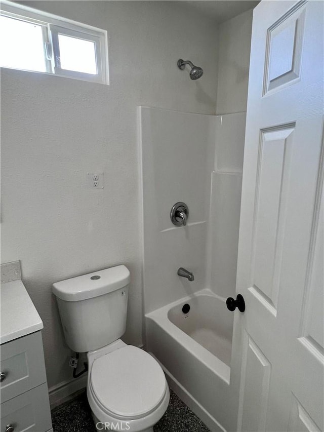 full bathroom featuring toilet, vanity, and bathtub / shower combination