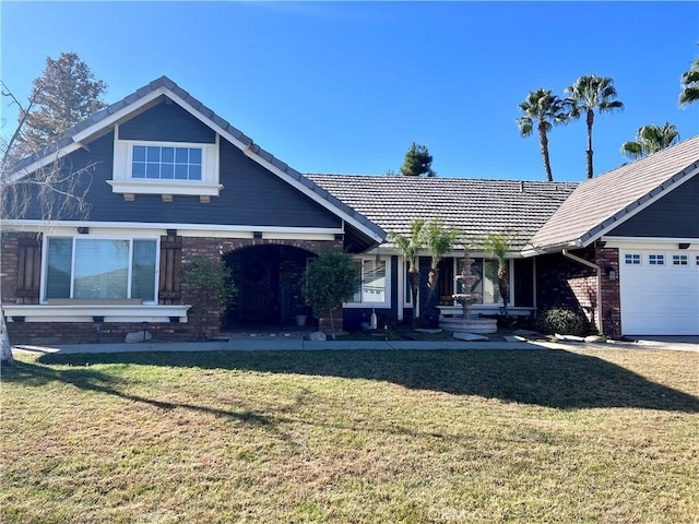 view of front of property with a front lawn and a garage