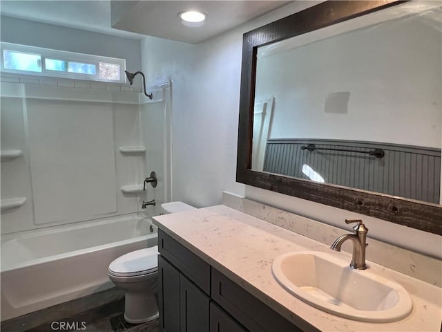 full bathroom featuring toilet, vanity, and bathing tub / shower combination