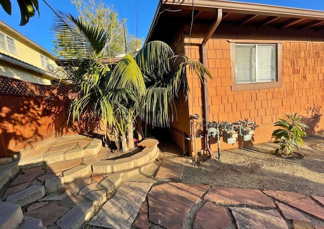 view of side of property featuring a patio area