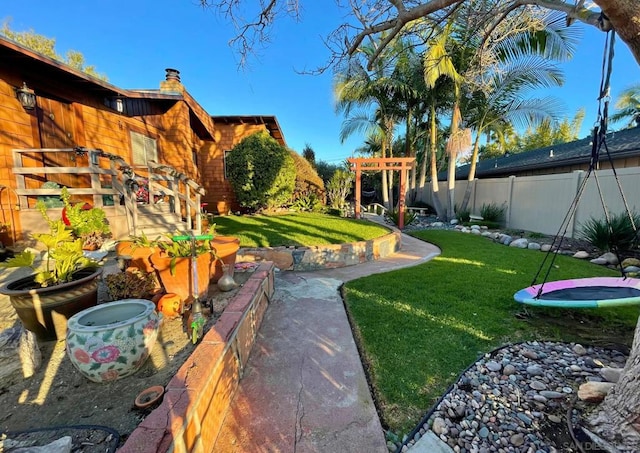 view of yard featuring a trampoline