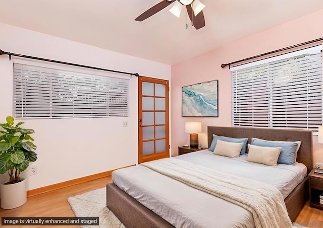 bedroom with ceiling fan and light hardwood / wood-style floors