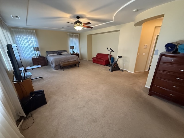 bedroom featuring ceiling fan and light carpet