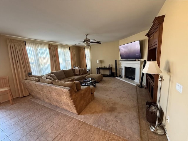 living room featuring ceiling fan and light tile patterned flooring