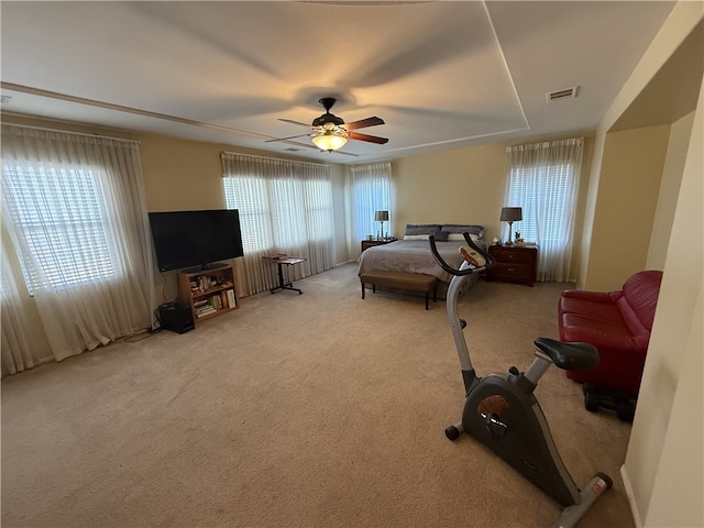 bedroom featuring ceiling fan and light colored carpet