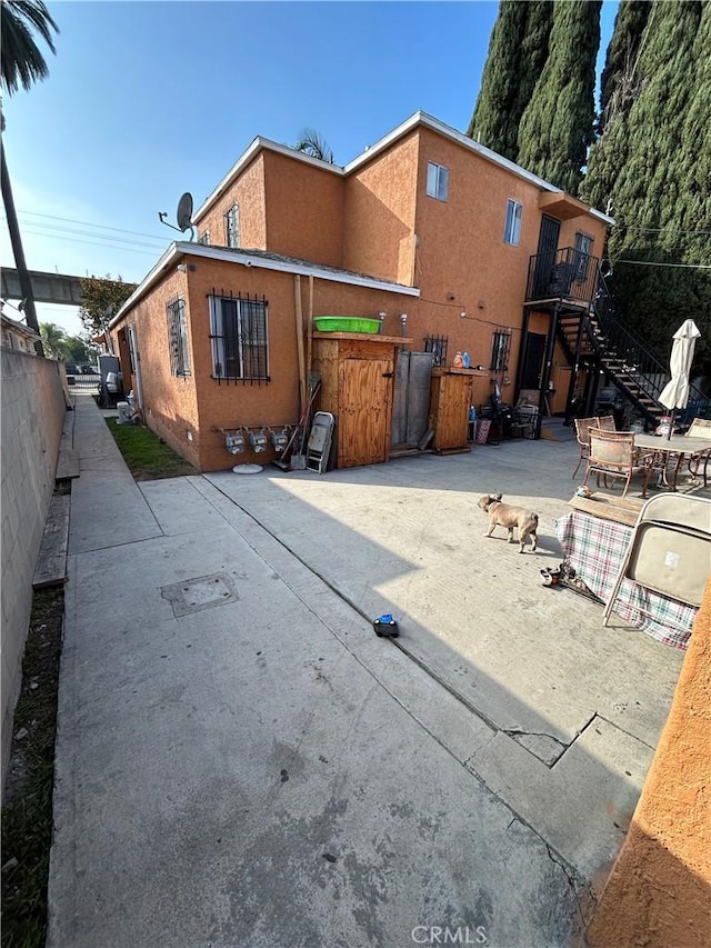 rear view of house featuring a patio