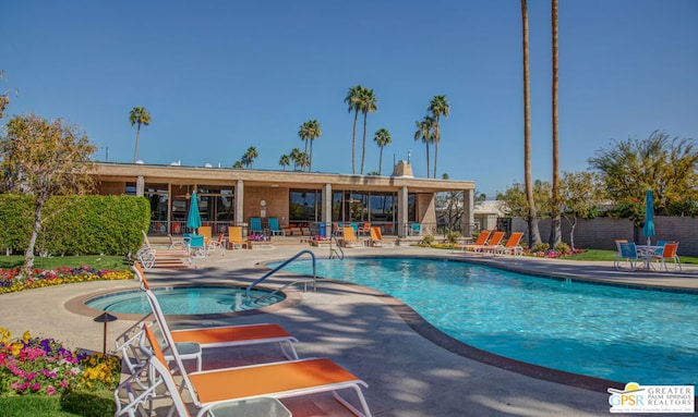 view of pool featuring a patio area and a community hot tub