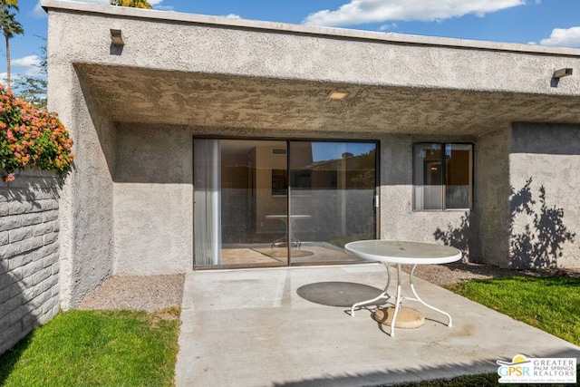 back of house with a patio