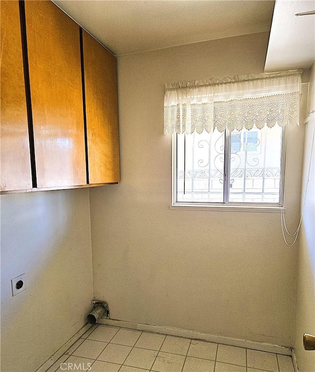 laundry area featuring cabinets and hookup for an electric dryer