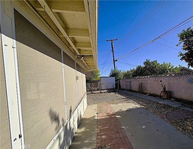 view of side of home featuring a patio