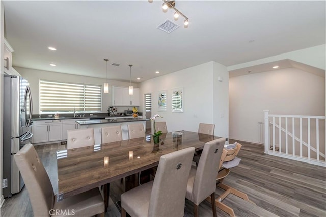 dining room featuring sink and hardwood / wood-style floors