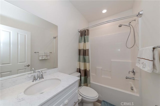 full bathroom featuring toilet, vanity, and shower / bath combo with shower curtain